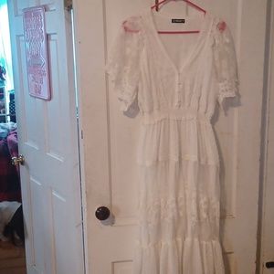 Empire waist fully lined Sheilay size medium pearl buttons.